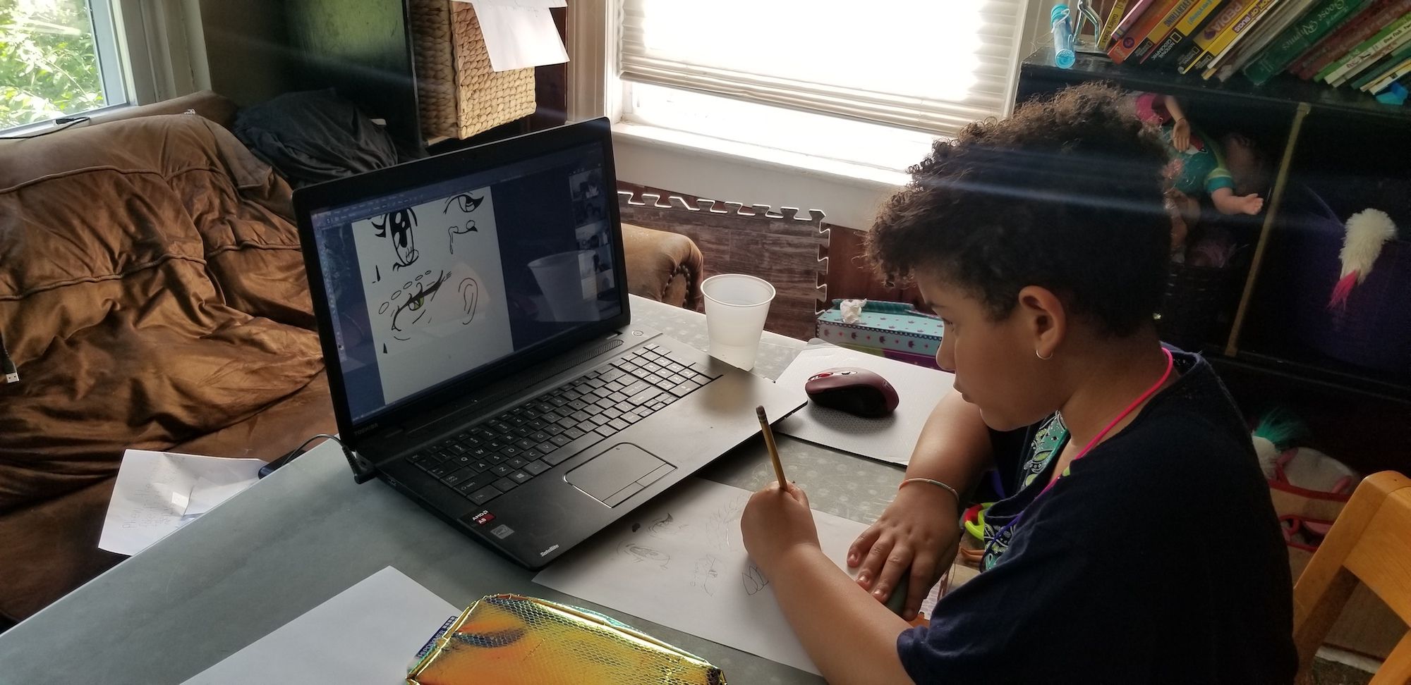 Young boy drawing in his bedroom at home